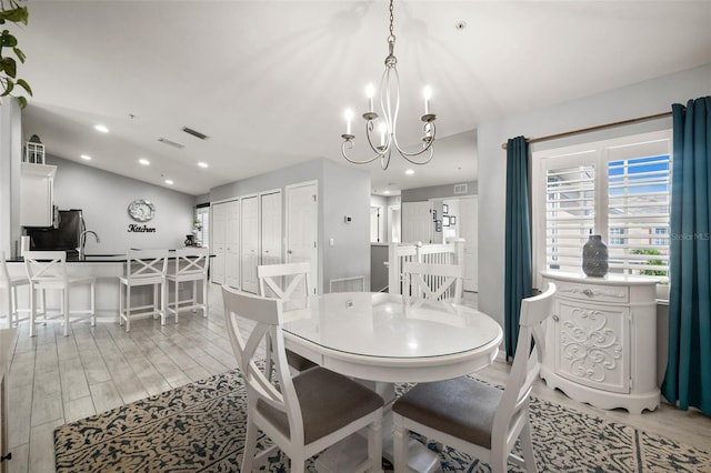 dining room with recessed lighting, a chandelier, light wood-style floors, visible vents, and baseboards
