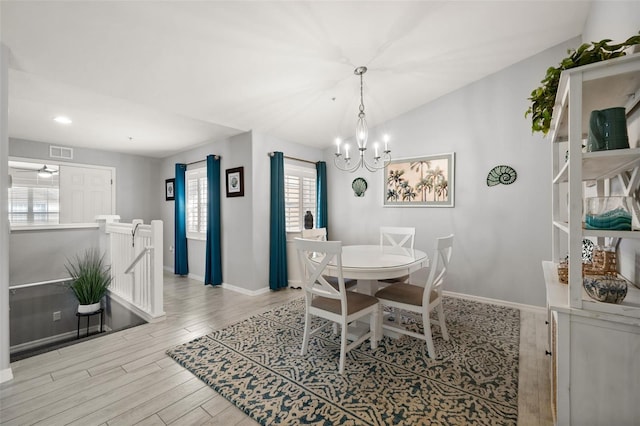 dining area featuring visible vents, baseboards, recessed lighting, wood finished floors, and a notable chandelier