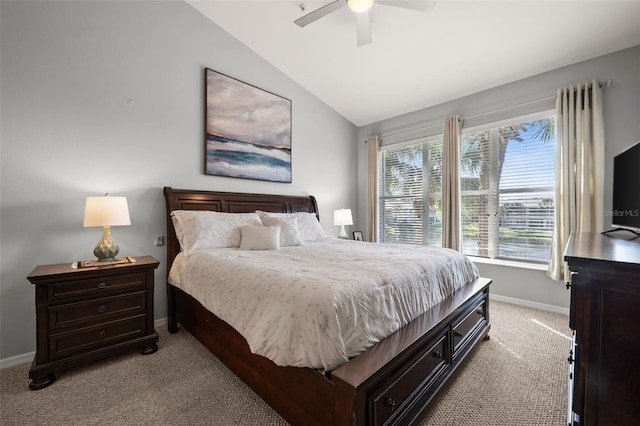 bedroom with baseboards, ceiling fan, carpet flooring, and vaulted ceiling