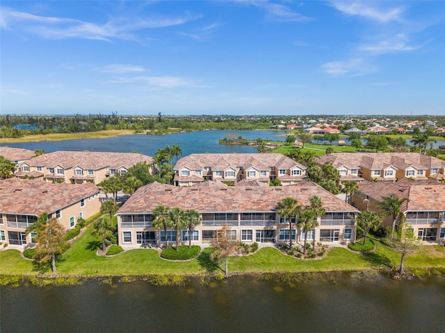 birds eye view of property featuring a residential view and a water view