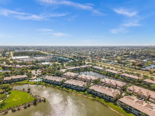 birds eye view of property with a residential view and a water view
