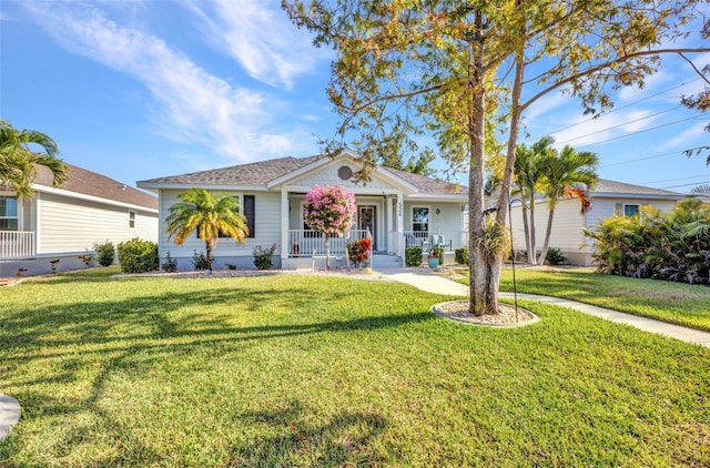 view of front of house featuring a front yard and a porch