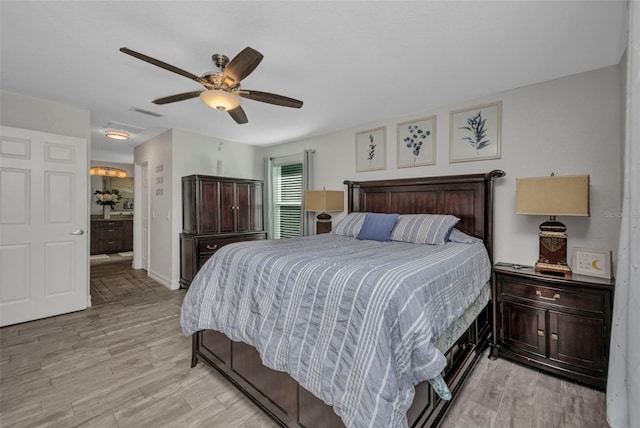 bedroom with visible vents, ceiling fan, and light wood-style flooring