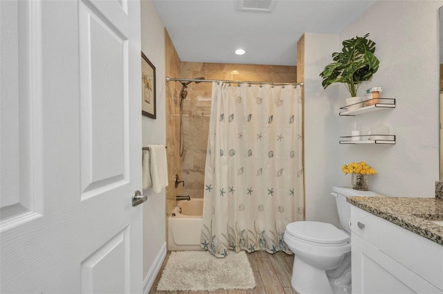 full bathroom featuring wood finished floors, shower / bath combo, toilet, vanity, and visible vents