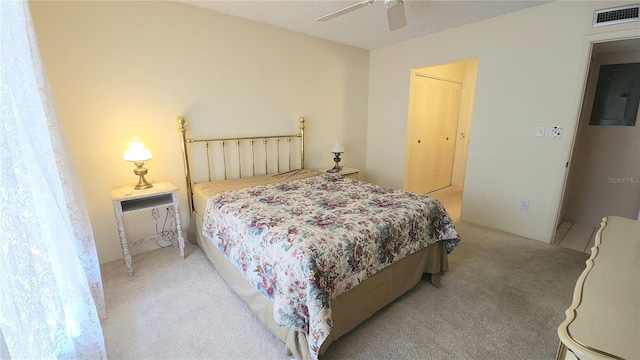 21300 Brinson Ave Unit 201, Port Charlotte, FL 33952 - bedroom with visible vents, a closet, light colored carpet, electric panel, and a ceiling fan