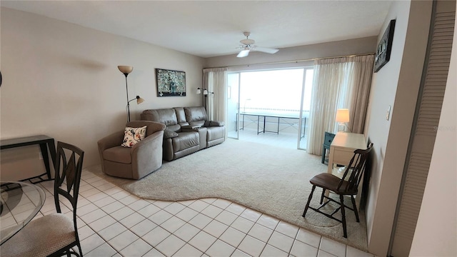 21300 Brinson Ave Unit 201, Port Charlotte, FL 33952 - living room with light tile patterned floors, a ceiling fan, and light colored carpet