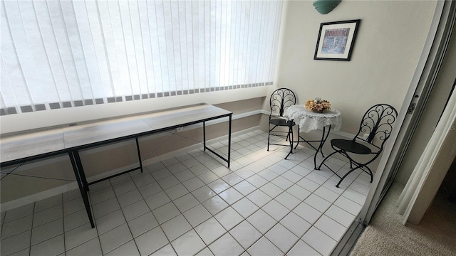 21300 Brinson Ave Unit 201, Port Charlotte, FL 33952 - dining room featuring baseboards and light tile patterned flooring