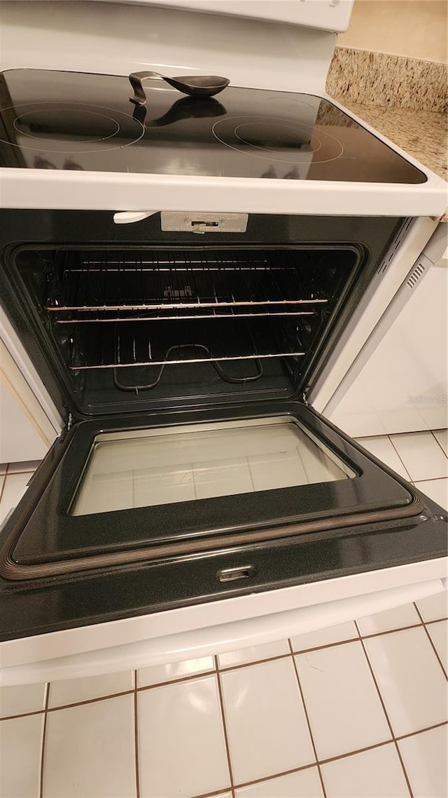 21300 Brinson Ave Unit 201, Port Charlotte, FL 33952 - room details with stove and white cabinets