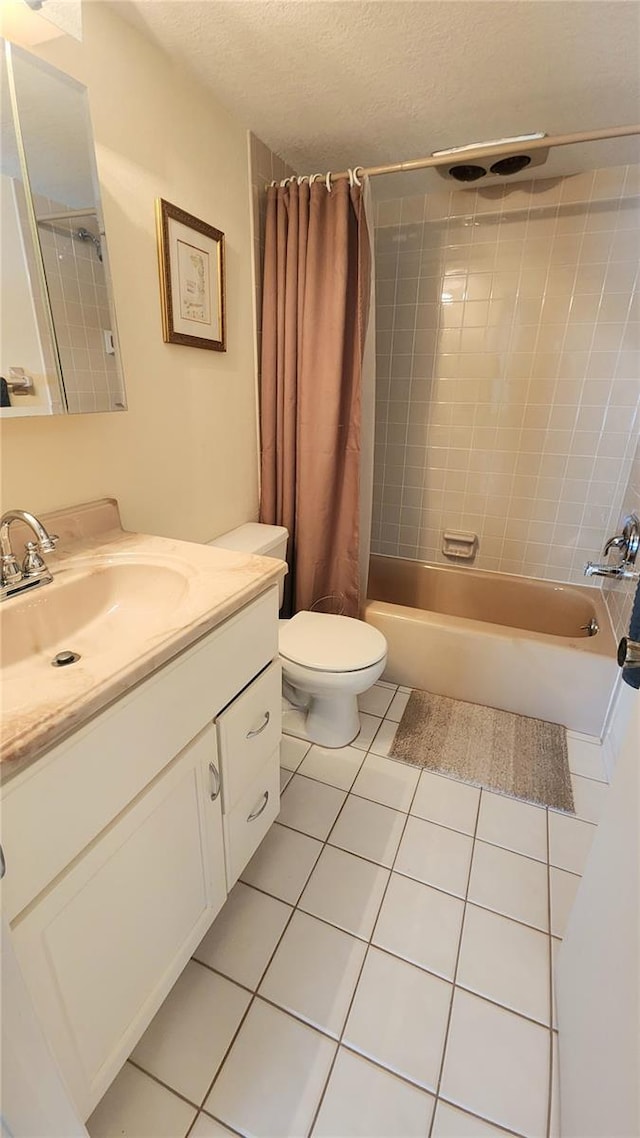 21300 Brinson Ave Unit 201, Port Charlotte, FL 33952 - bathroom featuring tile patterned flooring, vanity, toilet, a textured ceiling, and shower / bath combo