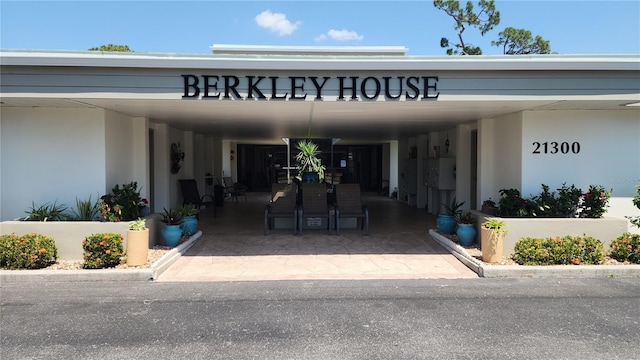 21300 Brinson Ave Unit 201, Port Charlotte, FL 33952 - view of exterior entry with stucco siding