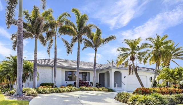 80 Hibiscus Dr, Punta Gorda, FL 33950 - single story home featuring a garage, stucco siding, a tiled roof, and concrete driveway