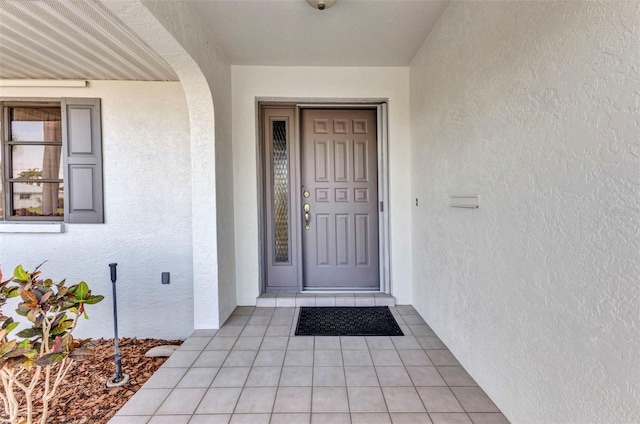 80 Hibiscus Dr, Punta Gorda, FL 33950 - doorway to property featuring stucco siding