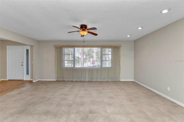 80 Hibiscus Dr, Punta Gorda, FL 33950 - unfurnished living room with ceiling fan, baseboards, and recessed lighting
