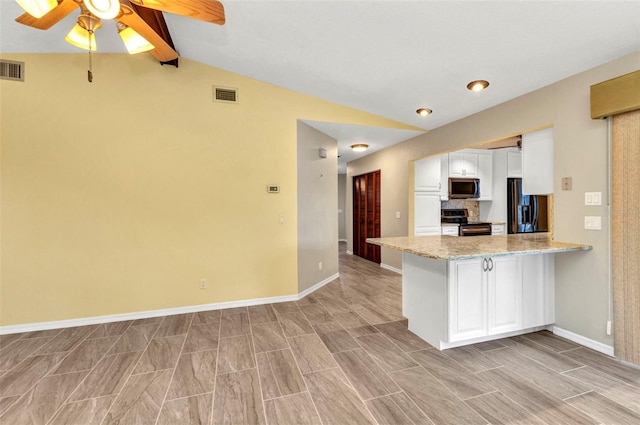 80 Hibiscus Dr, Punta Gorda, FL 33950 - kitchen featuring appliances with stainless steel finishes, white cabinetry, a peninsula, ceiling fan, and baseboards