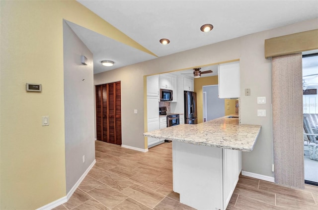 80 Hibiscus Dr, Punta Gorda, FL 33950 - kitchen featuring appliances with stainless steel finishes, white cabinetry, a peninsula, a breakfast bar area, and baseboards