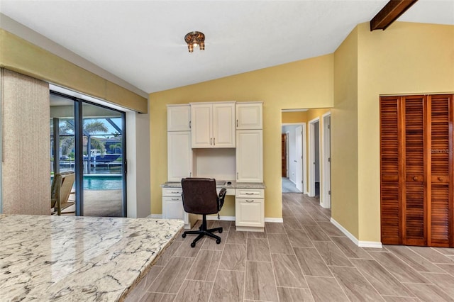 80 Hibiscus Dr, Punta Gorda, FL 33950 - office with lofted ceiling, built in study area, baseboards, and wood finish floors