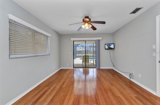 80 Hibiscus Dr, Punta Gorda, FL 33950 - unfurnished room featuring a ceiling fan, light wood-type flooring, and baseboards