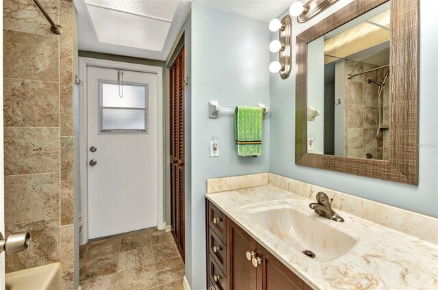 80 Hibiscus Dr, Punta Gorda, FL 33950 - full bathroom with vanity, a shower, and stone finish floors