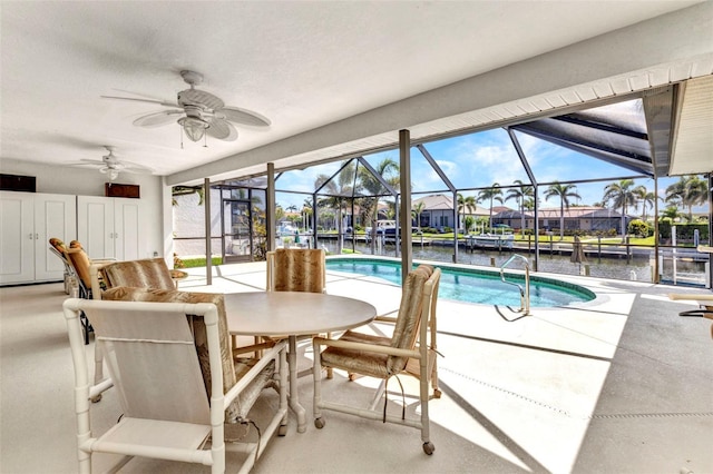 80 Hibiscus Dr, Punta Gorda, FL 33950 - swimming pool with a patio, ceiling fan, a water view, and a lanai