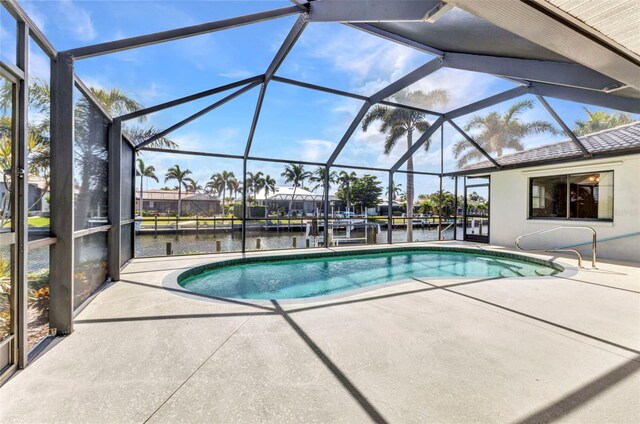 80 Hibiscus Dr, Punta Gorda, FL 33950 - swimming pool featuring a patio, a water view, and glass enclosure
