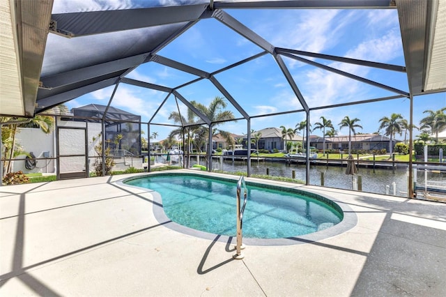 80 Hibiscus Dr, Punta Gorda, FL 33950 - outdoor pool with a water view, a patio area, a residential view, and glass enclosure