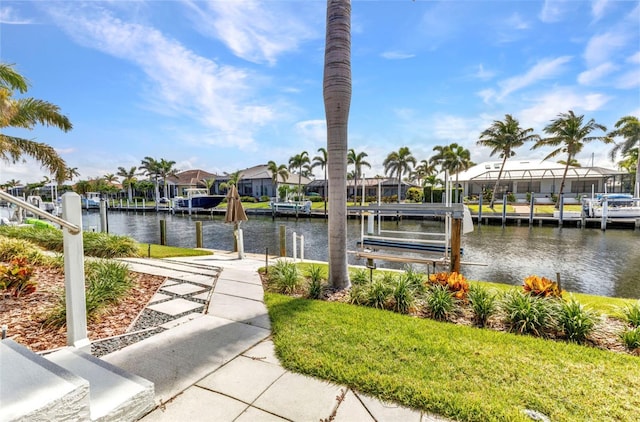 80 Hibiscus Dr, Punta Gorda, FL 33950 - dock area featuring boat lift, a water view, and a residential view
