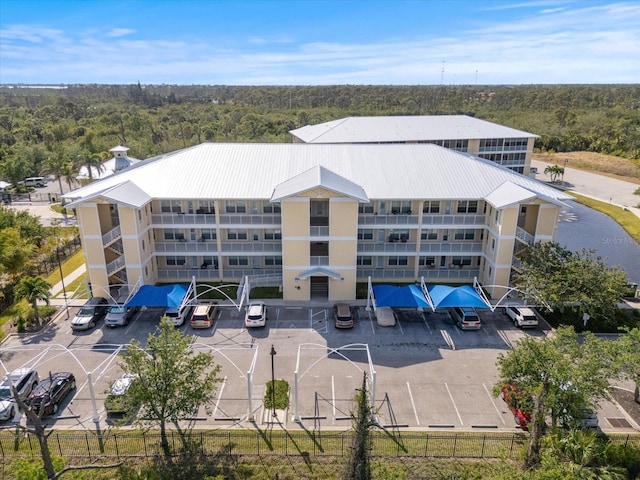 birds eye view of property with a wooded view
