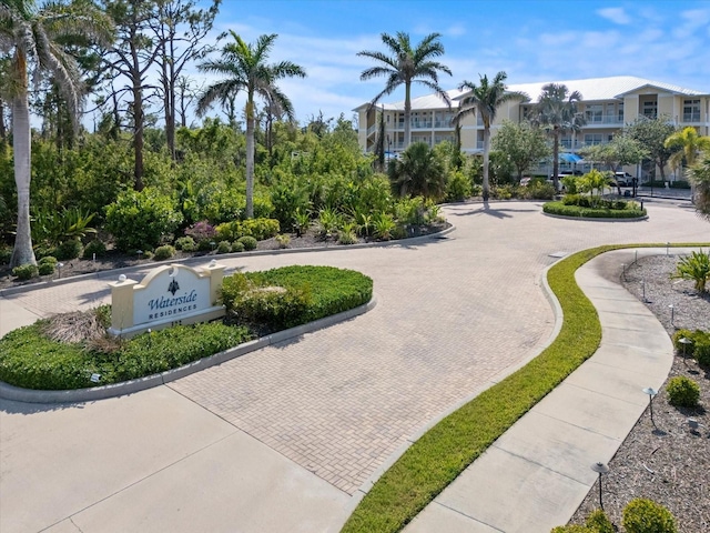 view of community with curved driveway