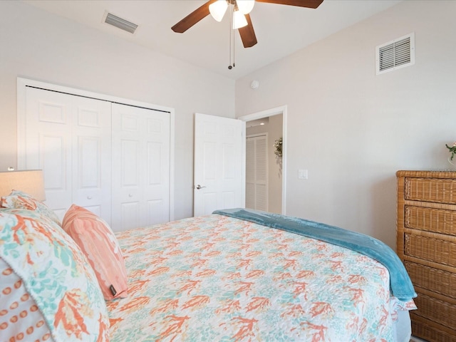 bedroom featuring a closet, visible vents, and ceiling fan