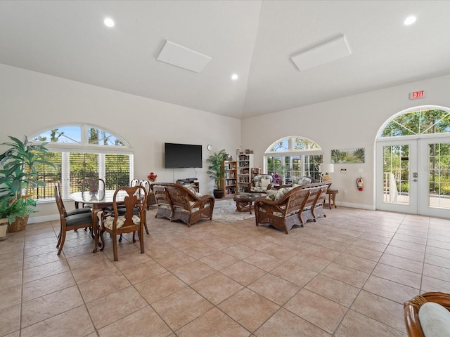 living room with recessed lighting, light tile patterned floors, high vaulted ceiling, baseboards, and french doors