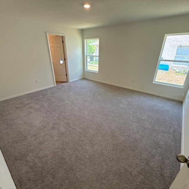 37 Packard Ln, Palm Coast, FL 32164 - carpeted empty room featuring baseboards