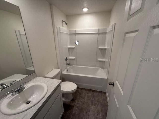 bathroom featuring vanity, shower / bathtub combination, toilet, and wood finished floors
