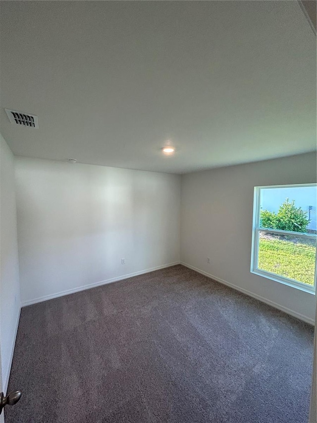 11 Zorro Ct, Palm Coast, FL 32164 - unfurnished room featuring baseboards, carpet, and visible vents