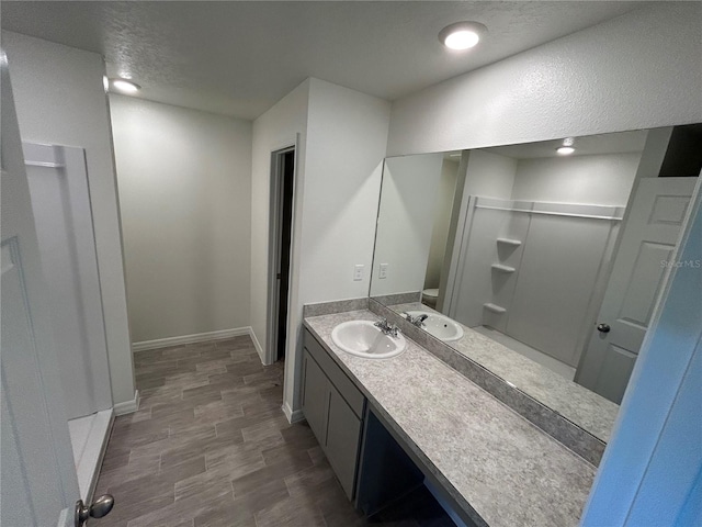 11 Zorro Ct, Palm Coast, FL 32164 - full bathroom featuring vanity, baseboards, wood finished floors, and toilet
