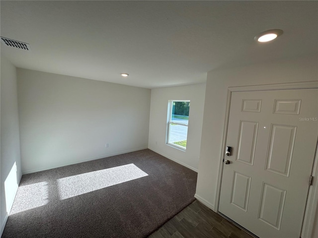 11 Zorro Ct, Palm Coast, FL 32164 - entrance foyer featuring dark wood-style flooring, dark carpet, recessed lighting, baseboards, and visible vents
