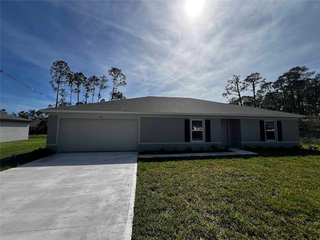 ranch-style home with an attached garage, concrete driveway, stucco siding, and a front yard