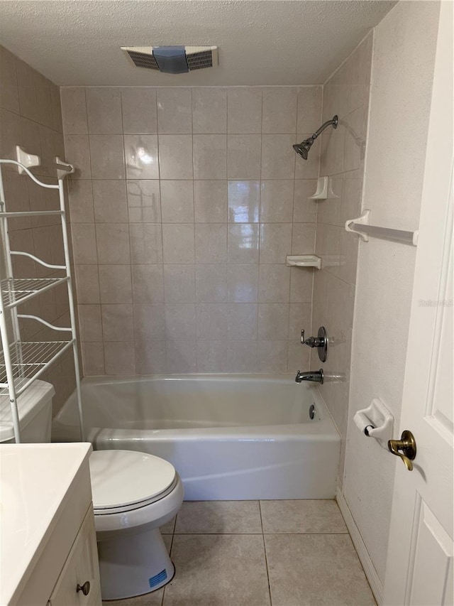 bathroom with vanity, toilet, tile patterned floors, bathing tub / shower combination, and visible vents