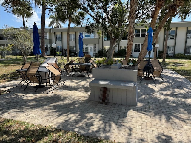 view of property's community with a patio