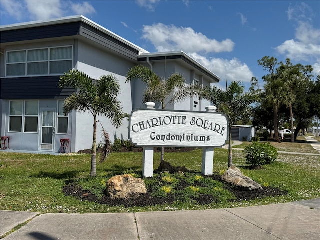21320 Brinson Ave Unit 112, Port Charlotte, FL 33952 - community sign with a yard
