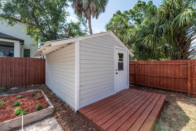 view of shed with a fenced backyard