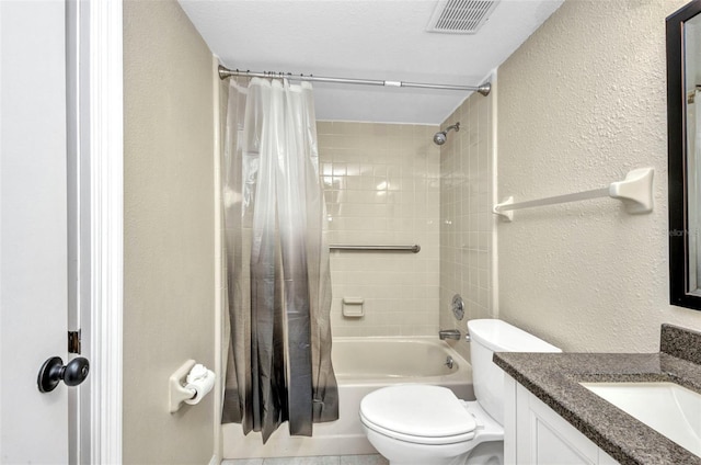 full bath with visible vents, vanity, toilet, shower / tub combo with curtain, and a textured wall