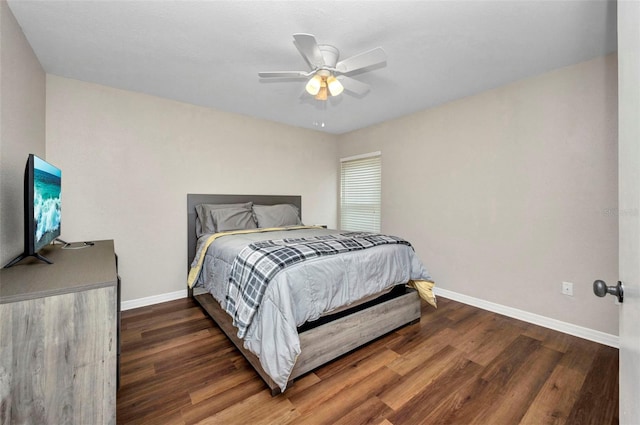 bedroom with baseboards, ceiling fan, and wood finished floors