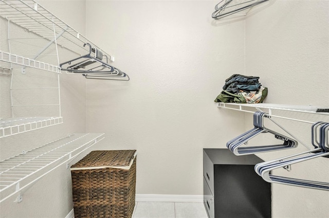 walk in closet featuring light tile patterned floors