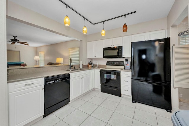 kitchen with white cabinets, light tile patterned flooring, a sink, and black appliances
