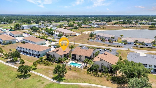bird's eye view featuring a residential view and a water view