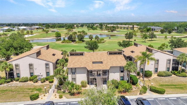 birds eye view of property featuring a water view and golf course view
