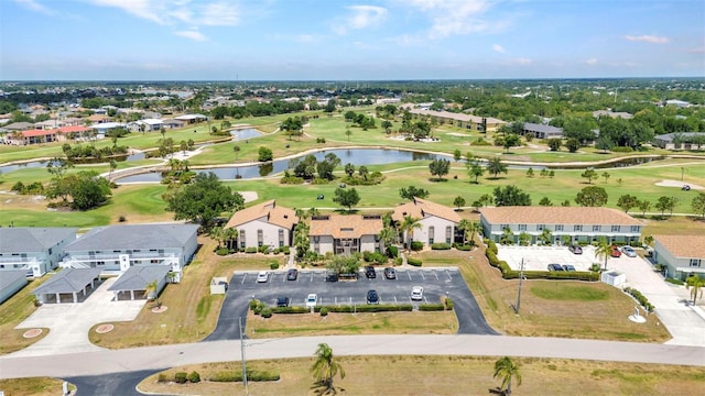 bird's eye view featuring a residential view, view of golf course, and a water view