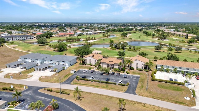 bird's eye view featuring a residential view, a water view, and golf course view