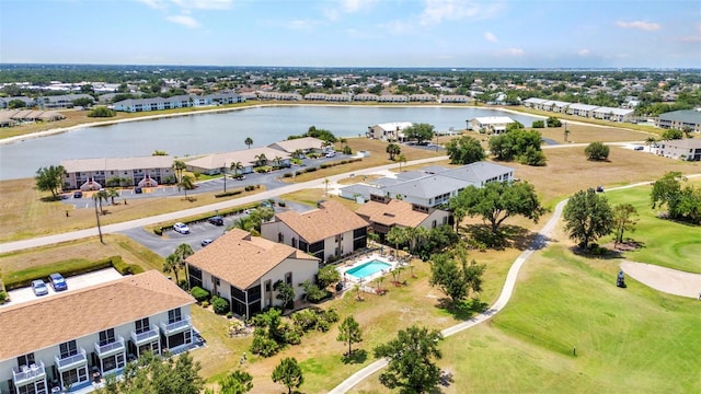 aerial view with a water view, view of golf course, and a residential view