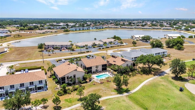 birds eye view of property with a water view and a residential view